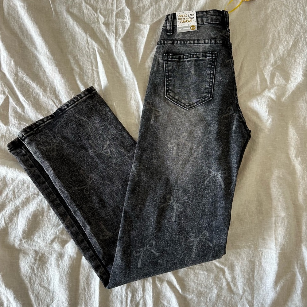 Women’s black jeans with bow design